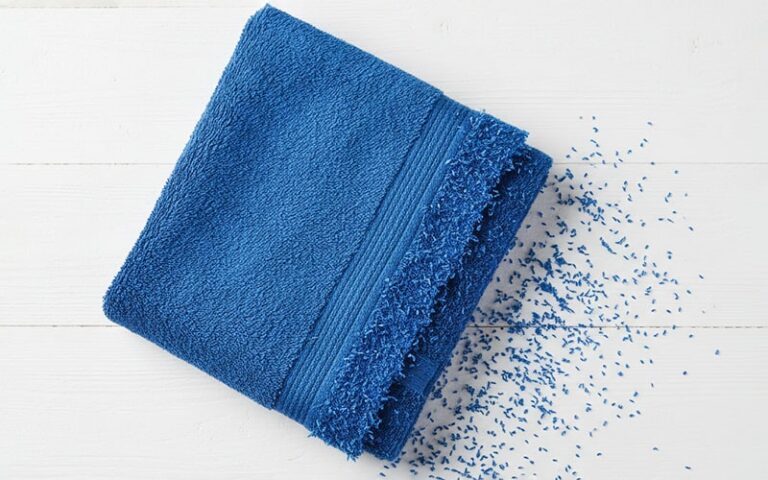 Blue cotton towel shedding lint fibers