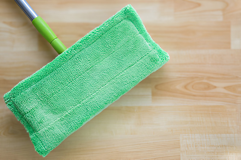 A green dry mop