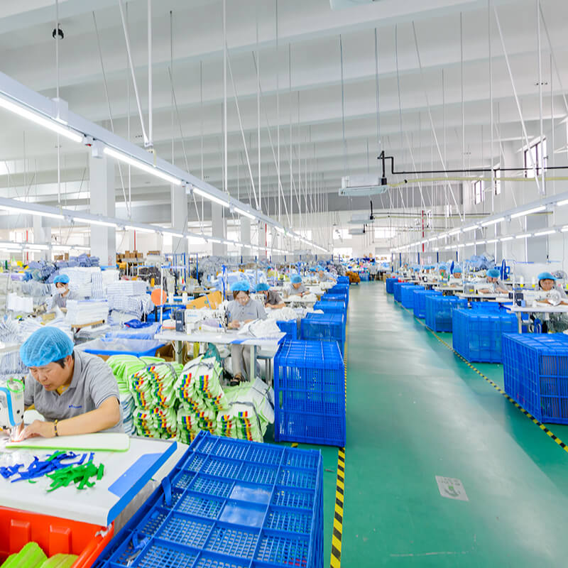 A group of employees diligently sewing microfiber mop heads