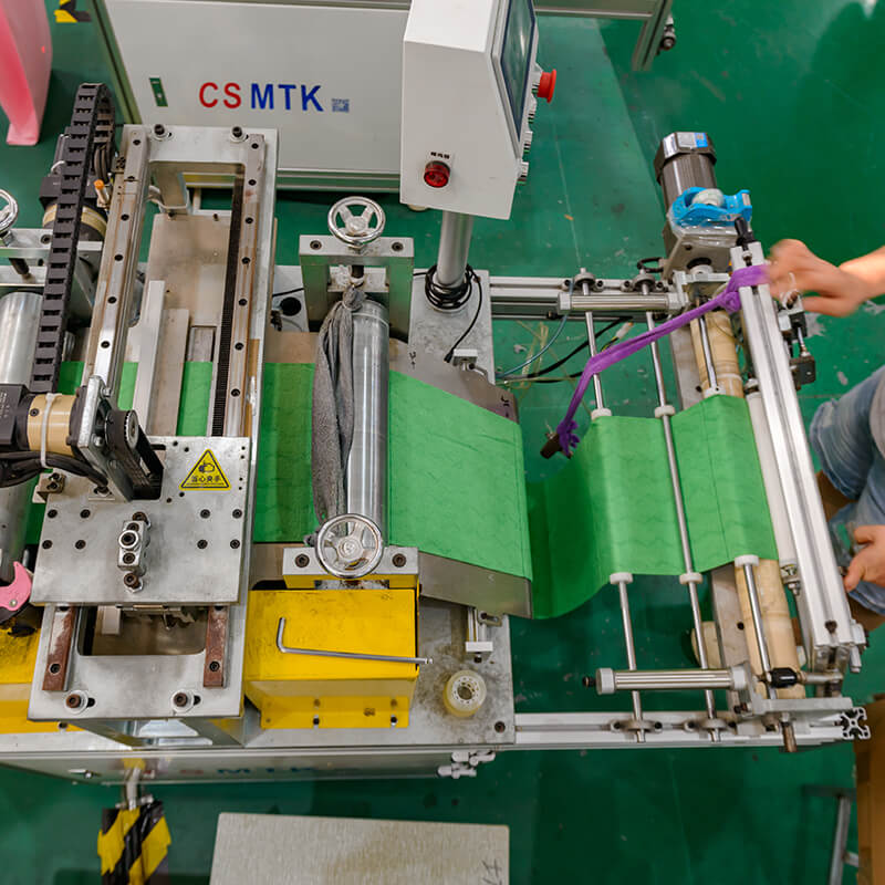 A machine for trimming and edging microfiber towels