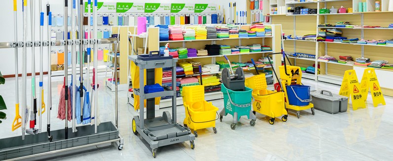 Various-towels,-mops,-and-Mop-bucket-are-placed-together.