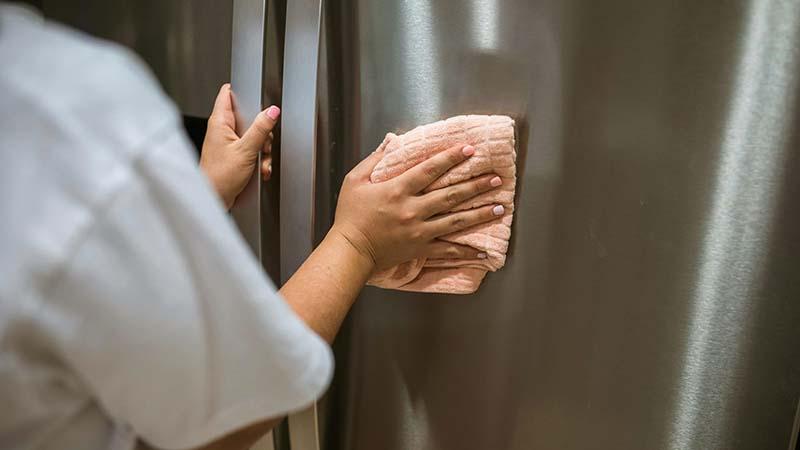 Microfiber towel on a stainless steel fridge door