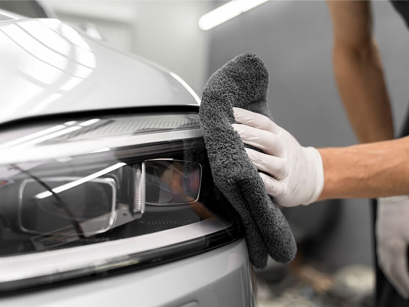Partial-view-of-one-hand-wiping-the-car