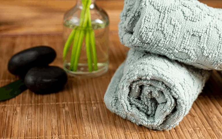 COVER Roll of textured bamboo towels at a spa